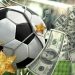 Balón de fútbol junto a muchos billetes de dólares